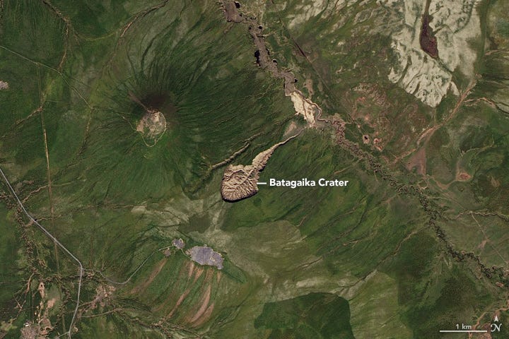 Aerial view of Batagaika Crater showcasing its size.