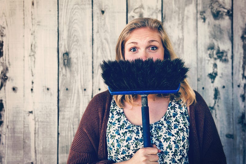 A woman contemplating the cleanliness of her home