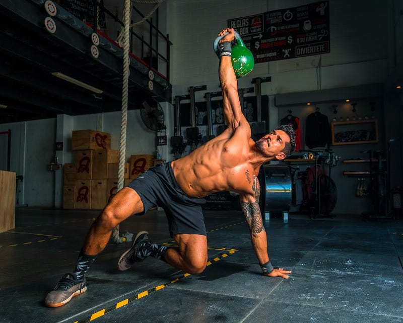 Person lifting weights in a gym.