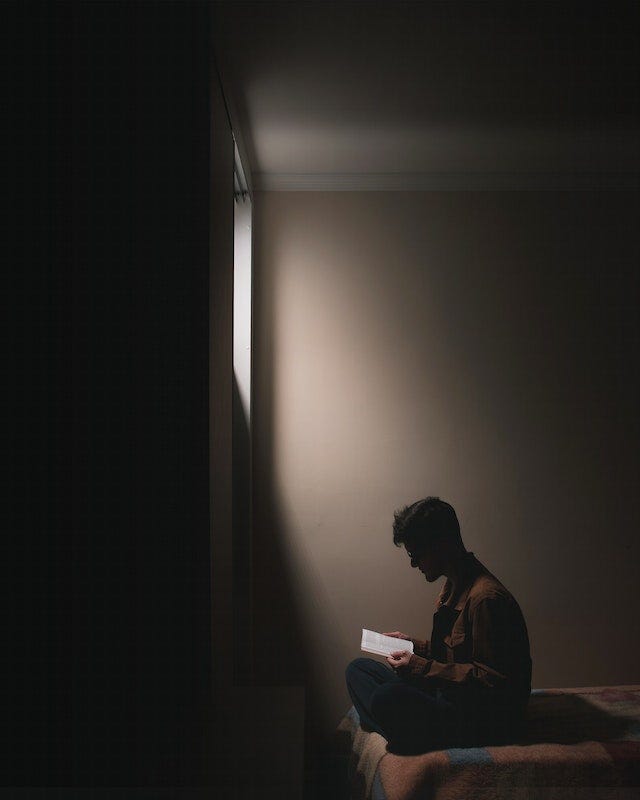 A person enjoying reading in a comfortable setting