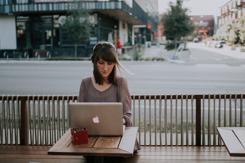 A cozy café setting with a laptop, symbolizing remote work