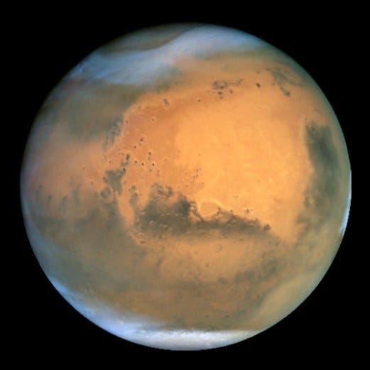 Photograph of Mars showcasing its polar ice caps