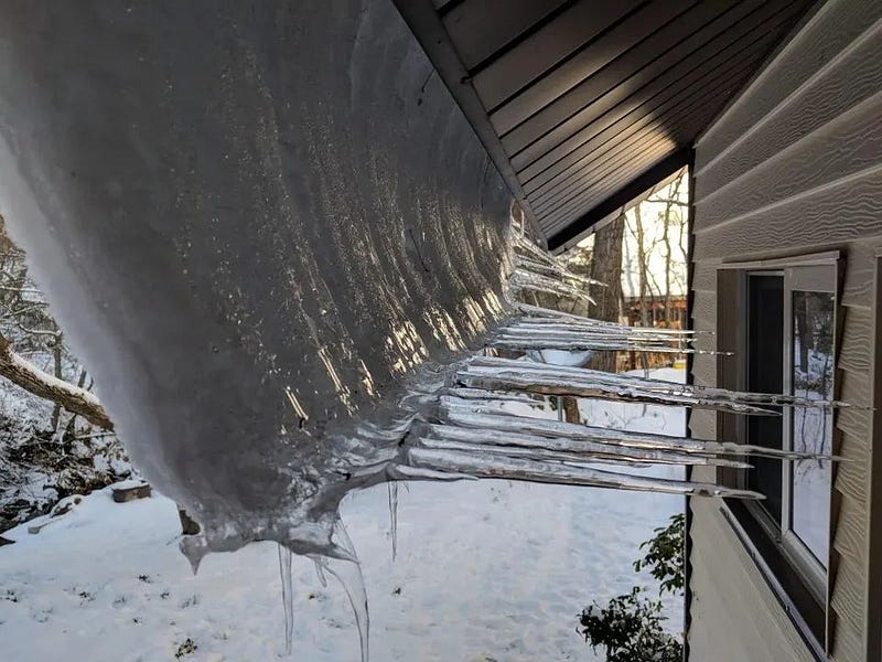 Ice formations sliding down from a roof.